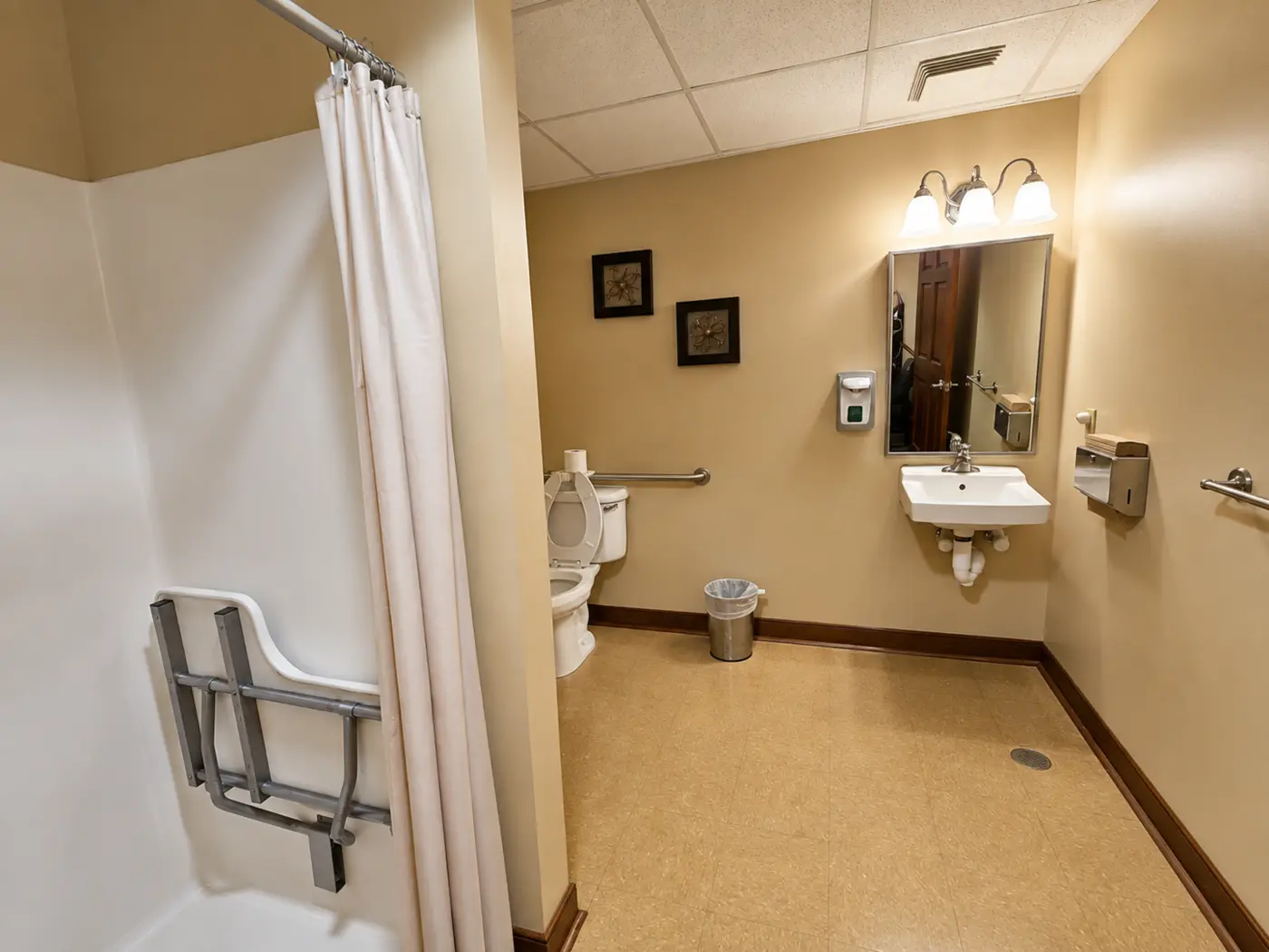 Accessible bathroom with shower and support rails
