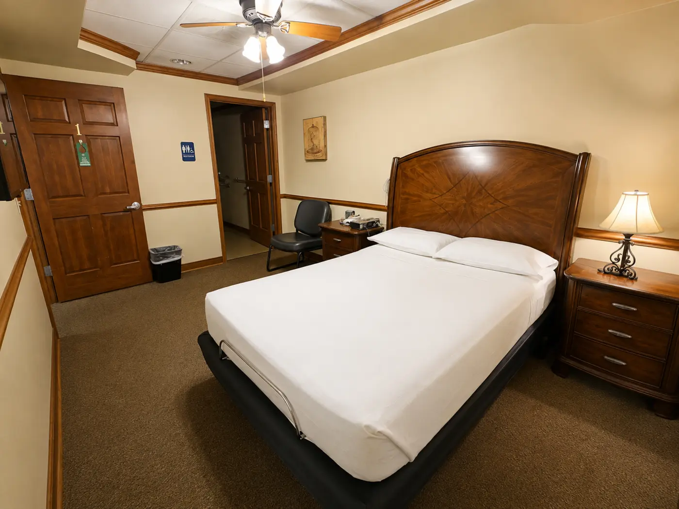 Private sleep room with bed and bedside furnishings