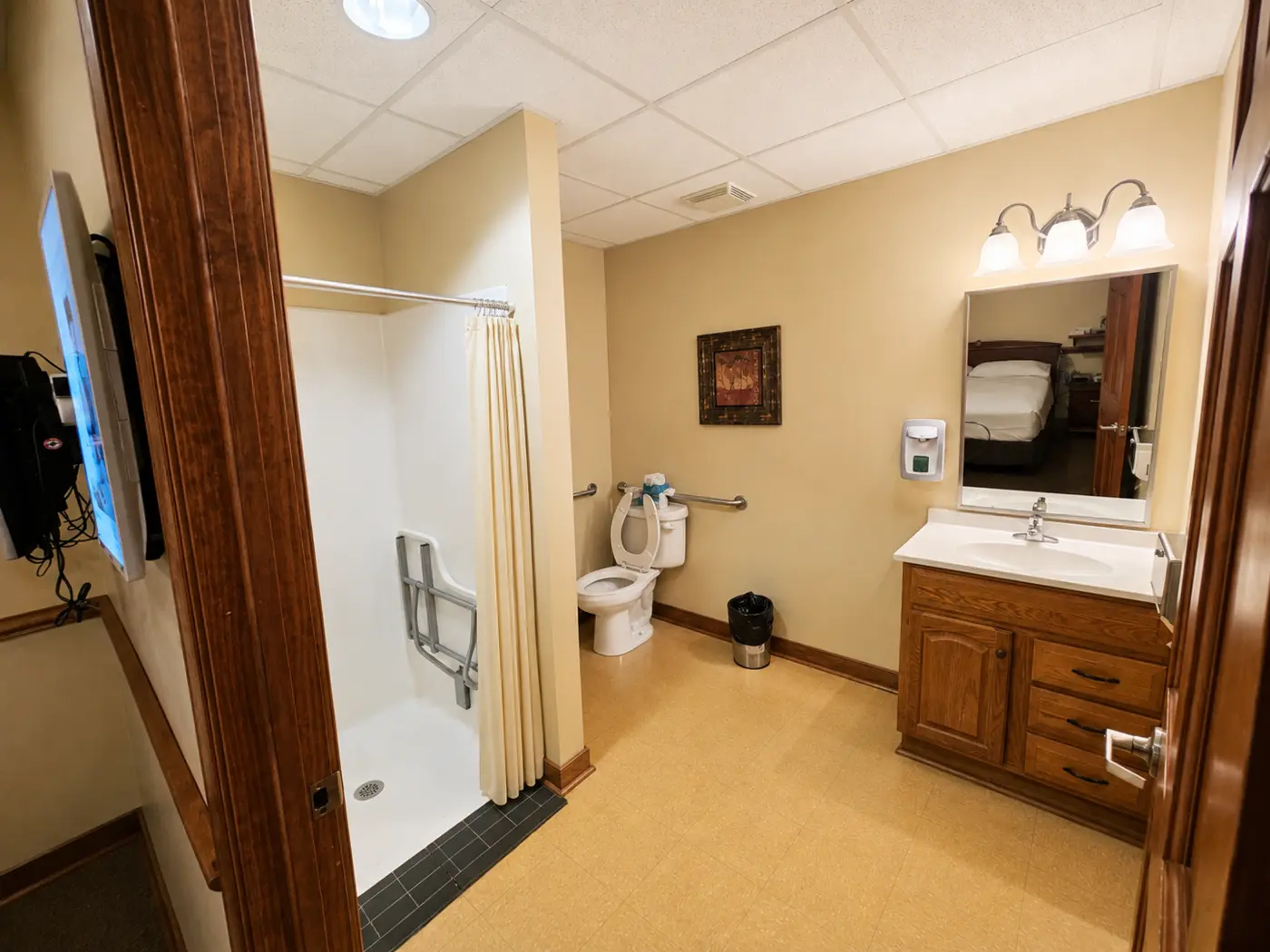 Private accessible bathroom with shower and vanity